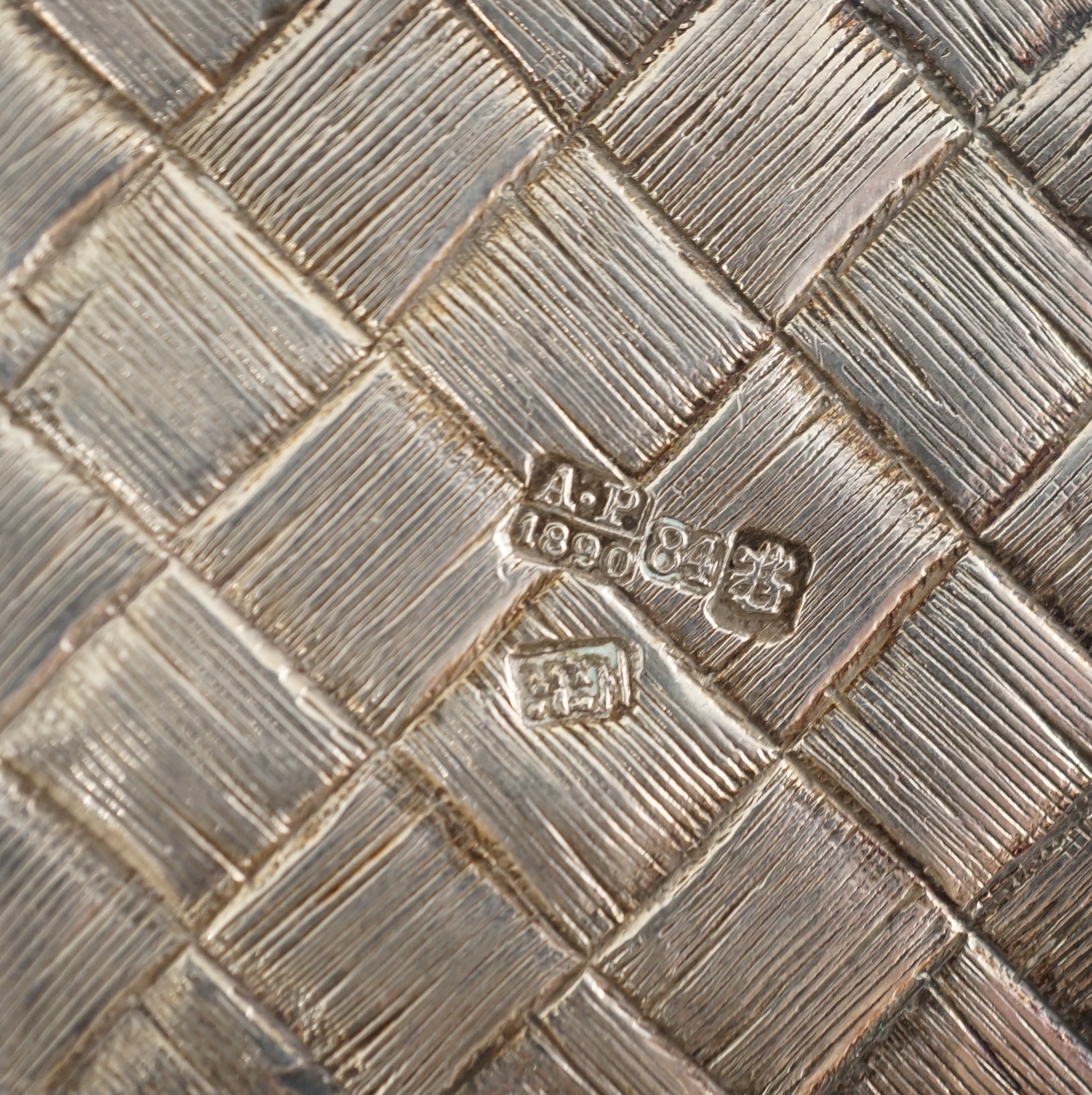 A late 19th century Russian 84 zolotnik silver bottle holder, with basket weave decoration, together with five similar tots